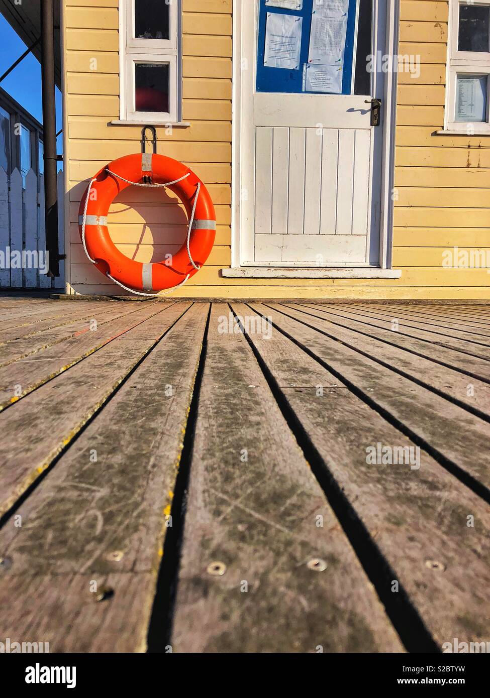 Life belt on a building at the end of Penarth pier, Penarth, Vale of Glamorgan. - Smartphone Captured Stock Image