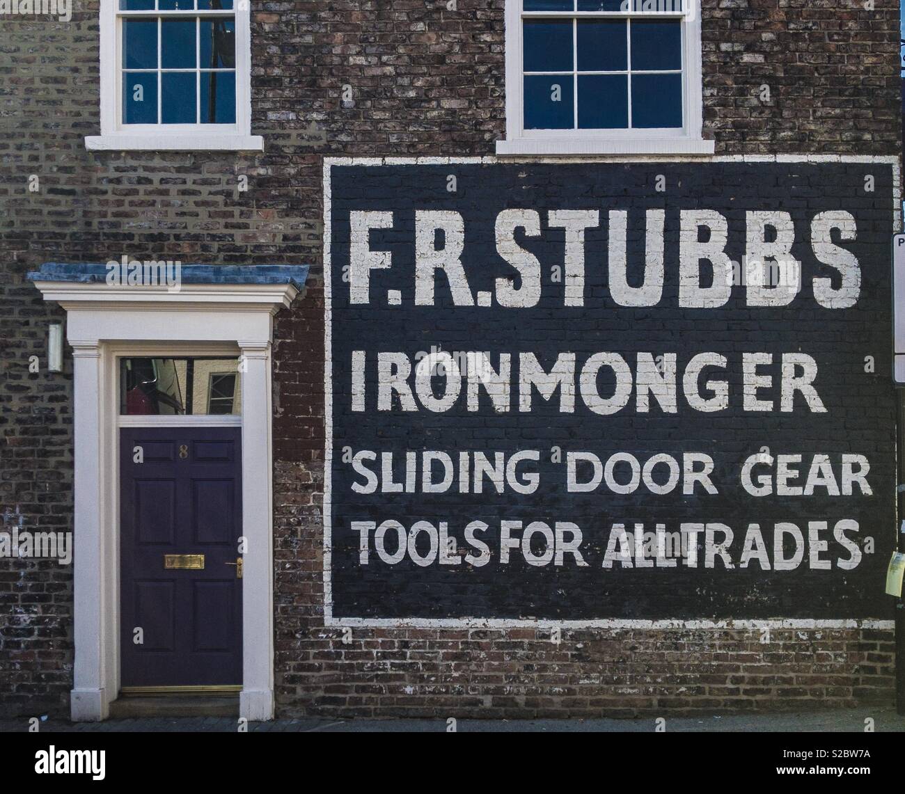 F R Stubbs Ironmonger sign on side of building - Smartphone Captured Stock Image F R Stubbs Ironmonger sign on side of building - Smartphone Captured Stock Image