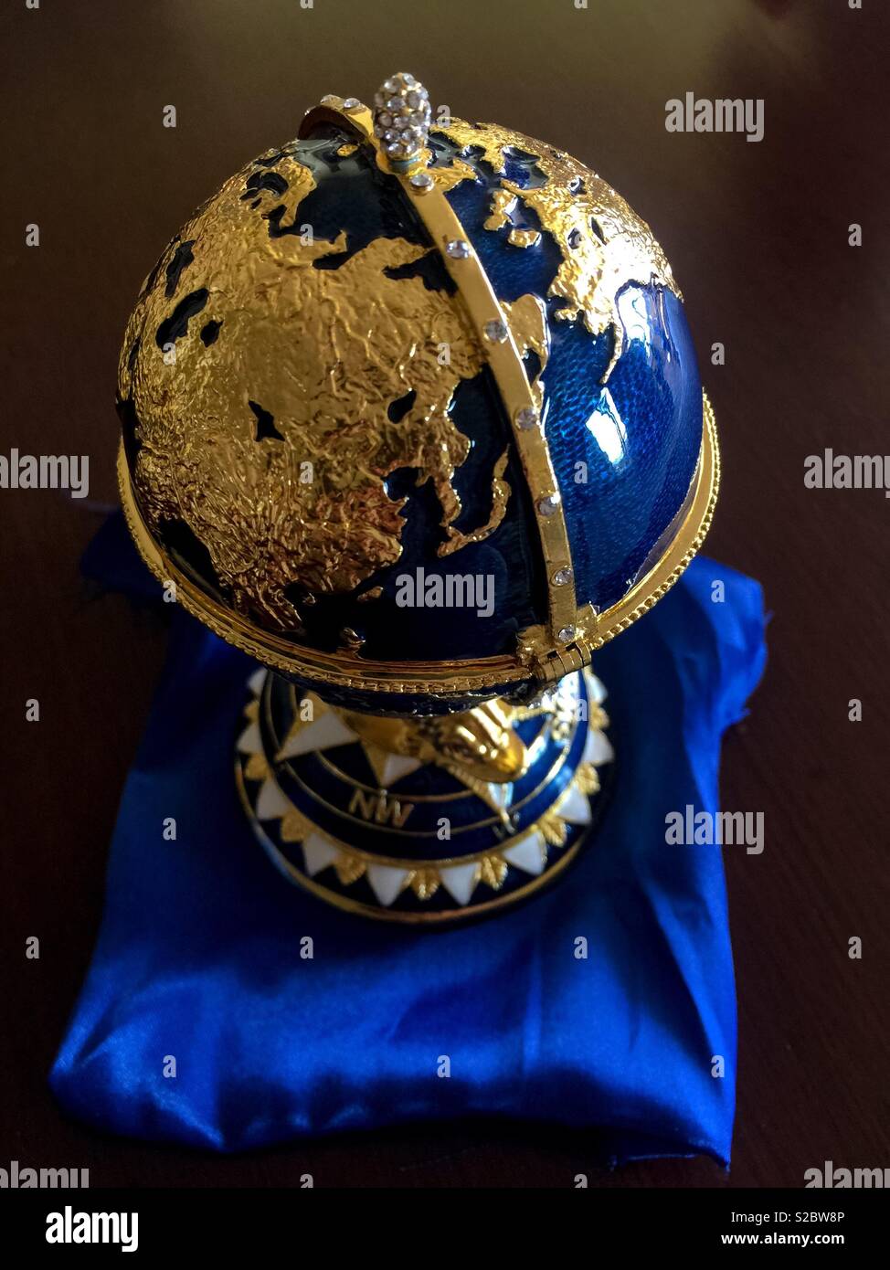 Fake but elegant Faberge Egg. Miniature. Replica. Copy. For show. Souvenir. Not the real thing. - Smartphone Captured Stock Image