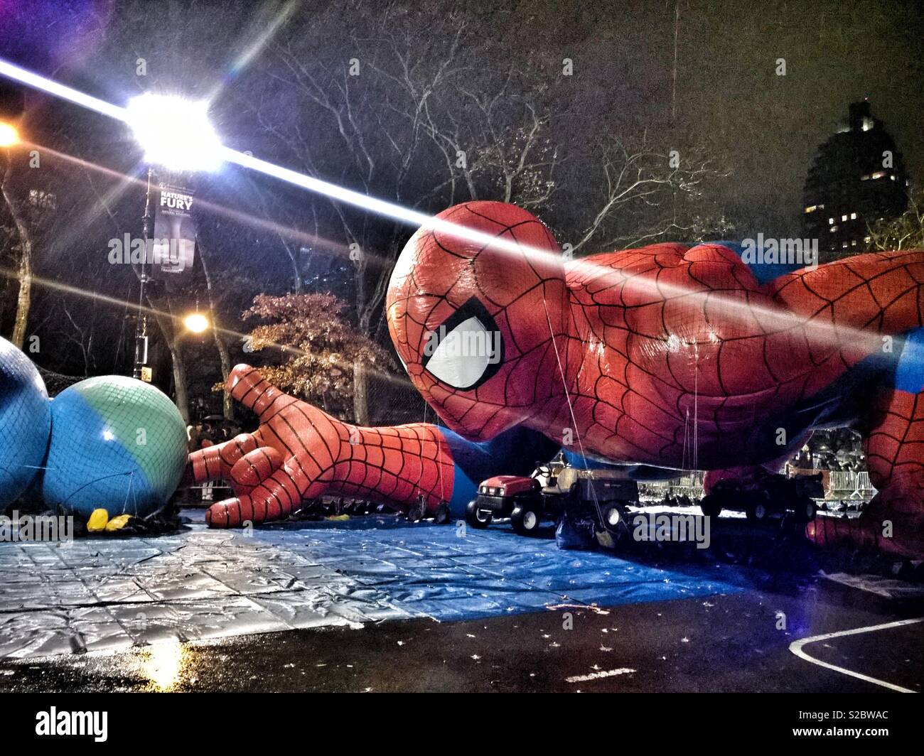 Spider-Man balloon ready for the Thanksgiving Day parade in New York City, parked in front of the Natural History Museums - Smartphone Captured Stock Image