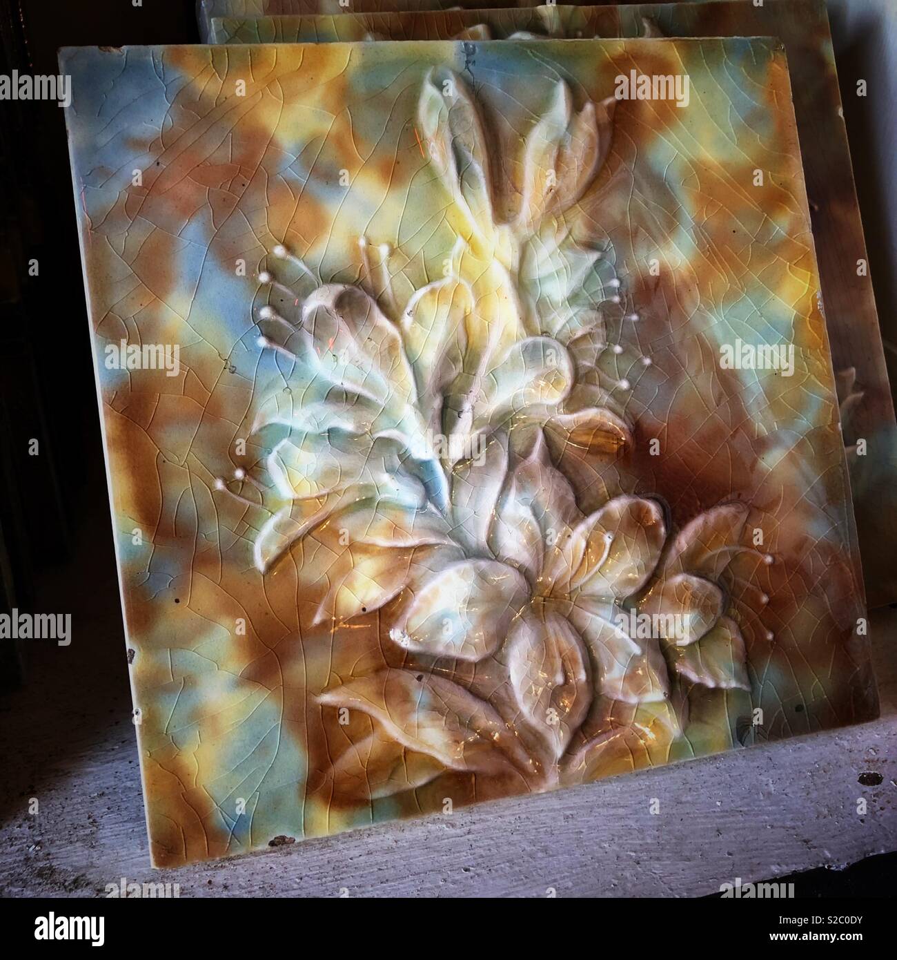 Antique ceramic tile found at Ohmega Salvage in Berkeley, California. - Smartphone Captured Stock Image