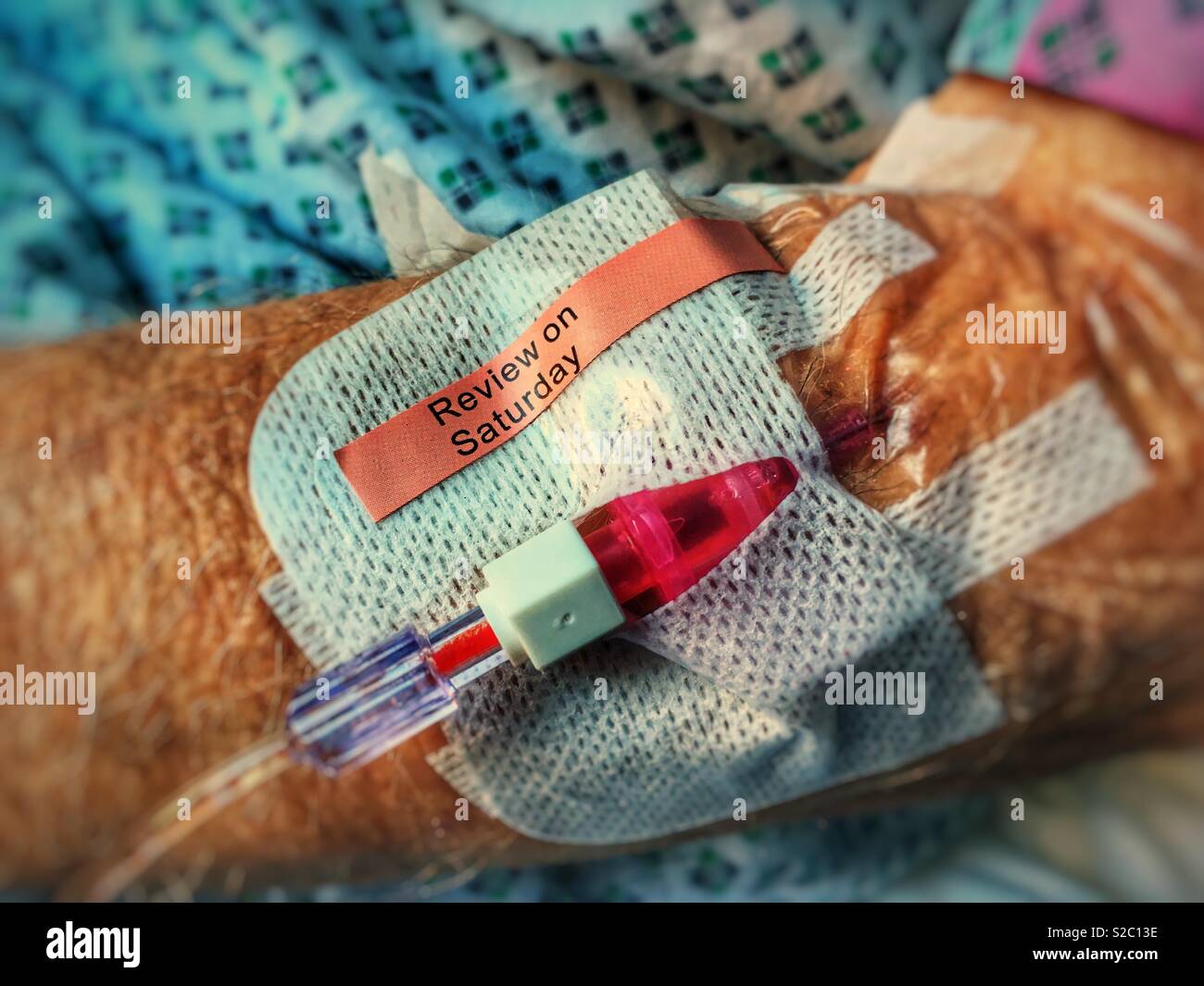 NHS patient with drip in arm - Smartphone Captured Stock Image