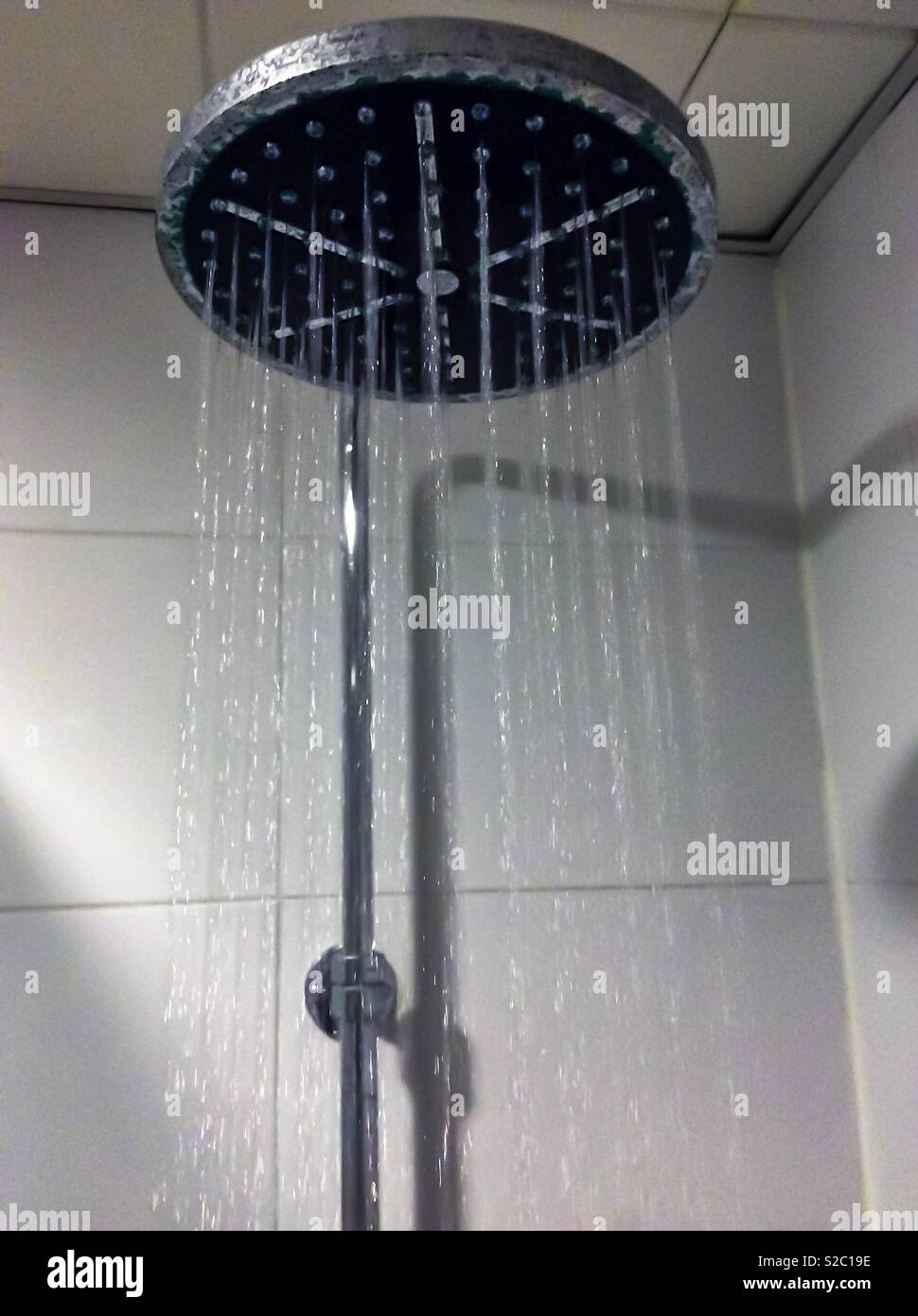 A shower head with rubbing water. - Smartphone Captured Stock Image