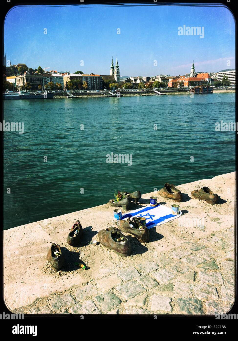 The ‘Shoes on the Danube Bank’, Budapest, Hungary. The trail of iron shoes is a memorial to Jews shot here by Arrow Cross militiamen in WW2. Stock Photo