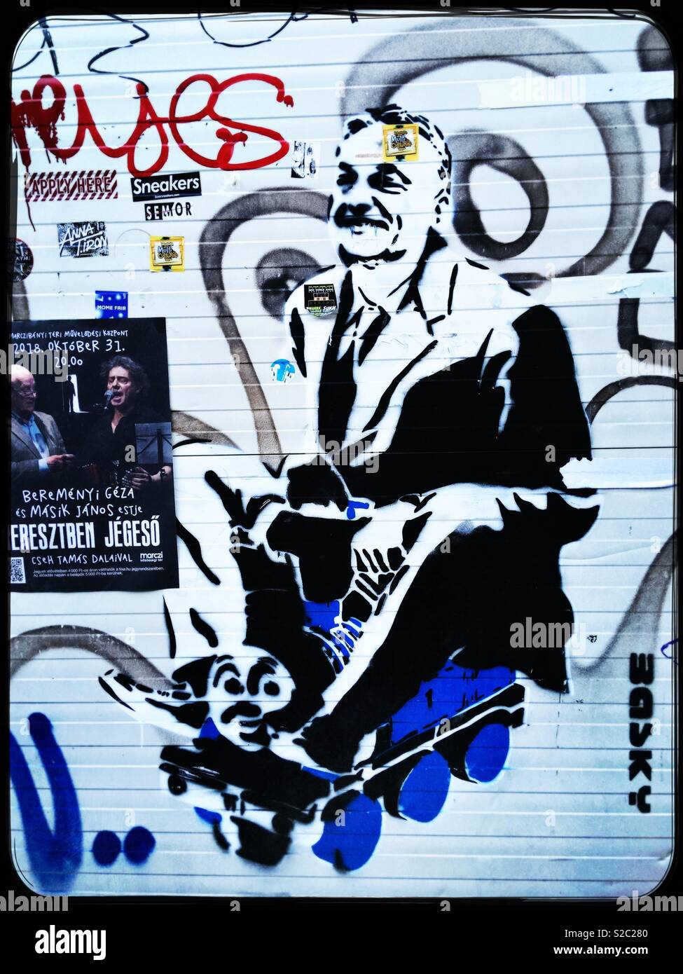 Graffiti depiction of Hungary’s Prime Minister Orban riding Thomas the Tank Engine. Jewish Quarter, Budapest, Hungary. - Smartphone Captured Stock Image