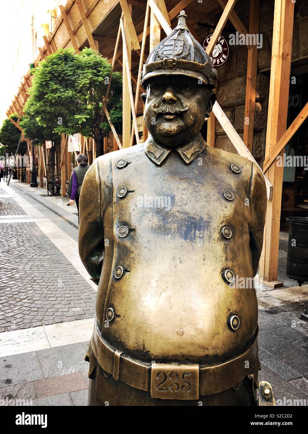 Bronze statue of ‘Uncle Charlie’ aka The Fat or Jovial Policeman. Budapest, Hungary. - Smartphone Captured Stock Image