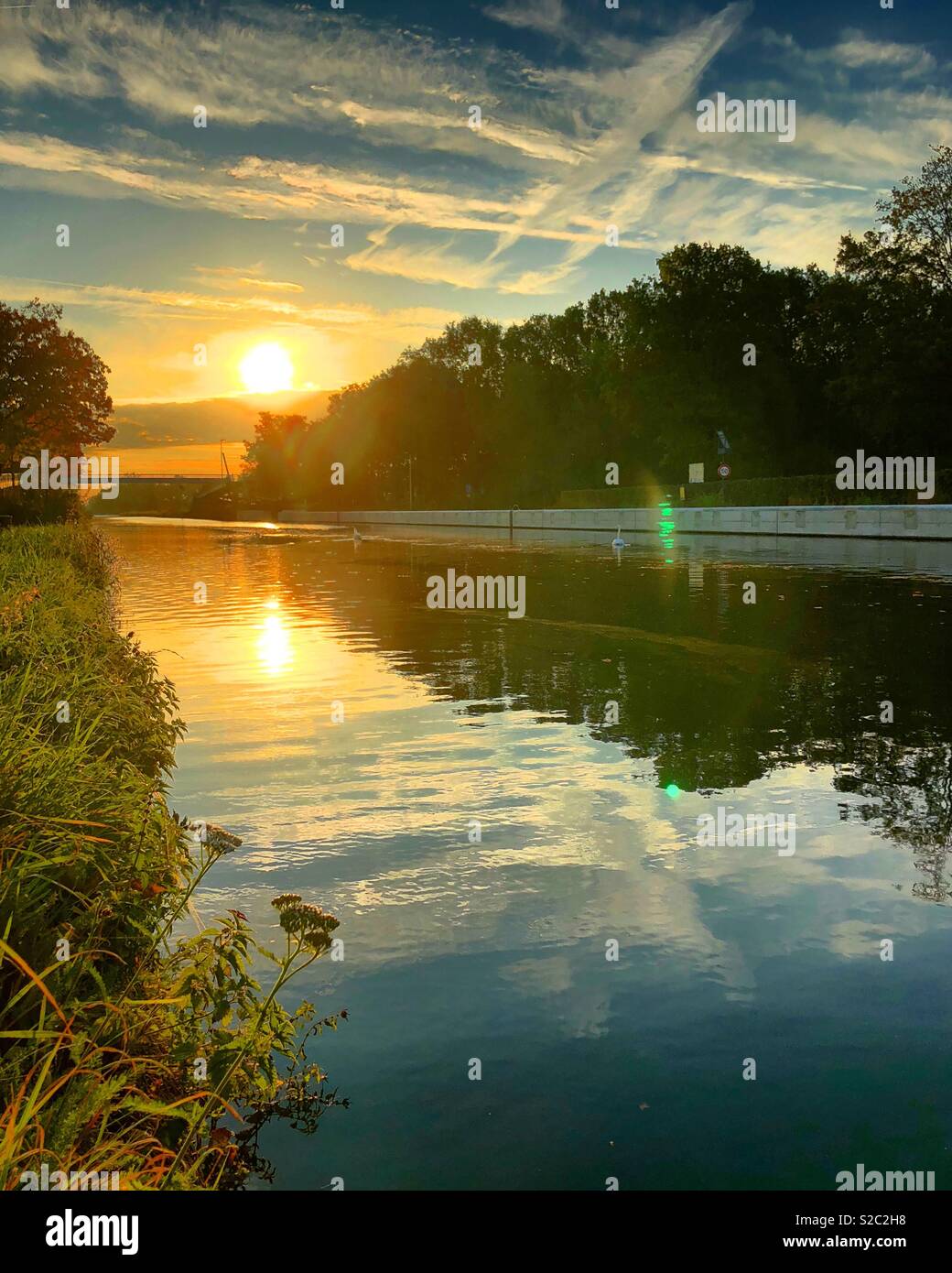Sunrise reflected in the water of the river - Smartphone Captured Stock Image