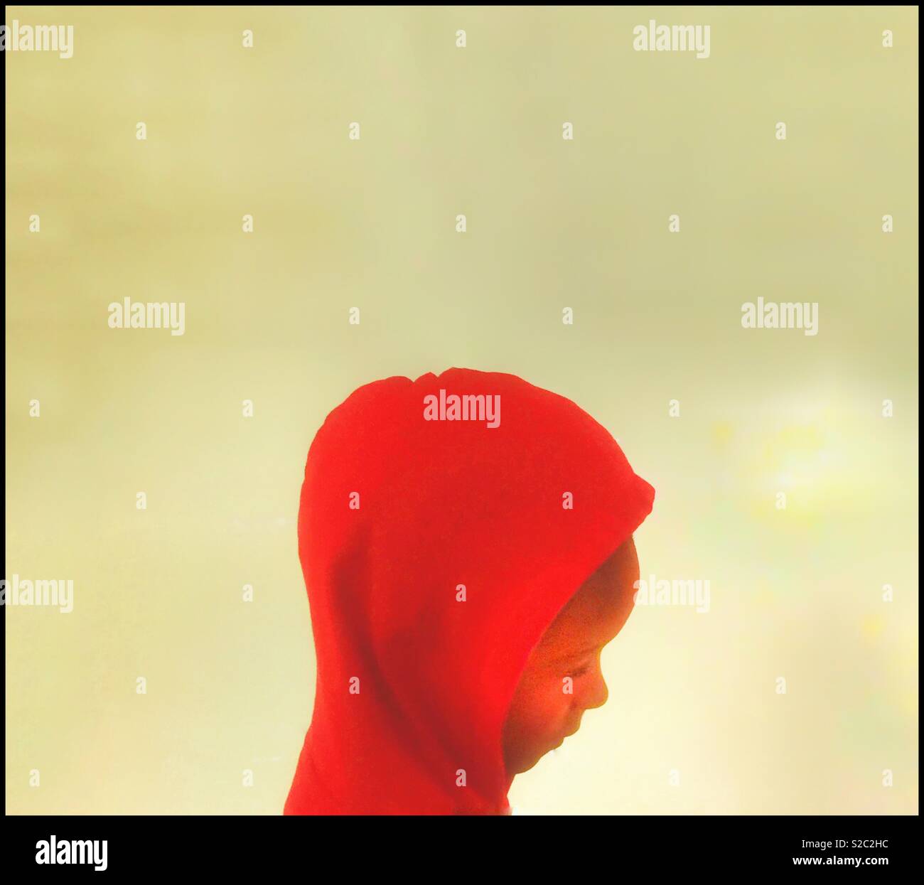 Child in a red hoody. - Smartphone Captured Stock Image