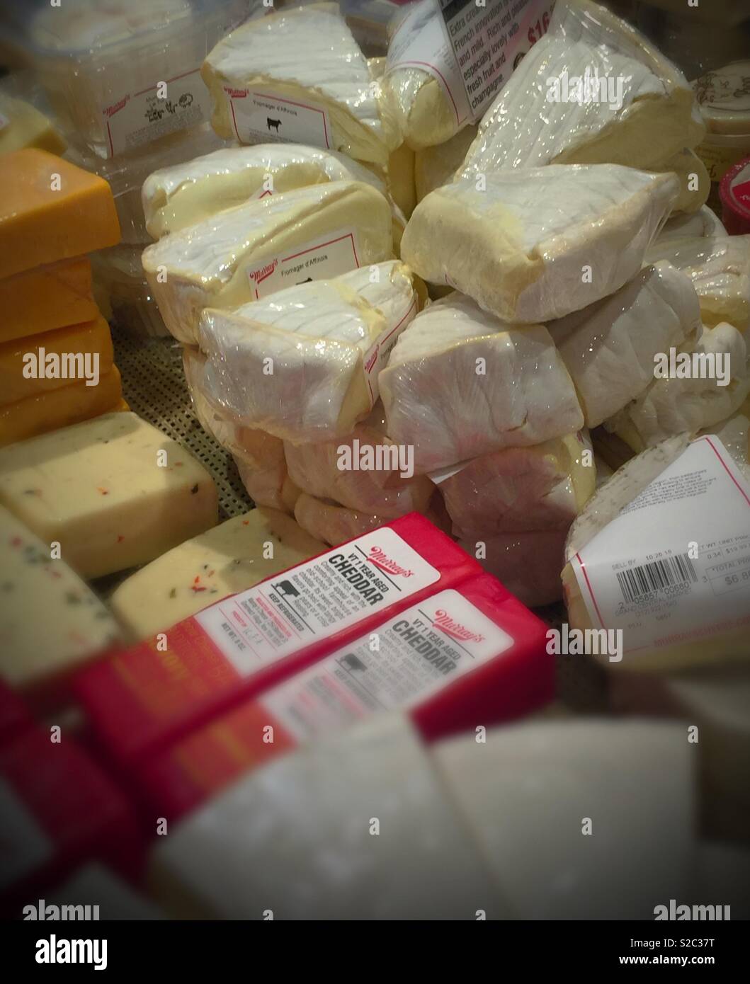 Cheese for sale at Murray’s cheese shop, Grand Central terminal, NYC, USA - Smartphone Captured Stock Image