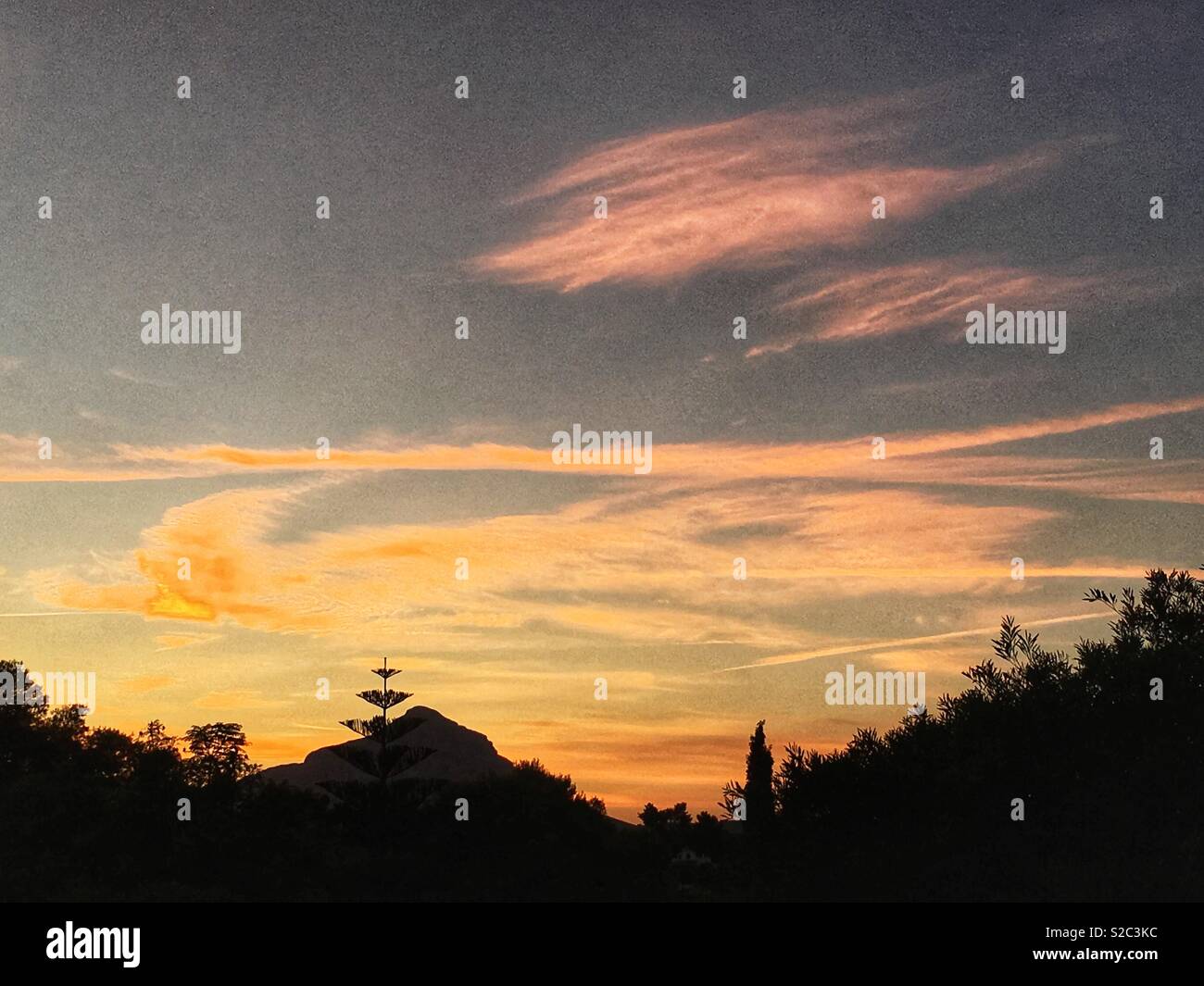 Sunset over mountain landscape Stock Photo - Alamy