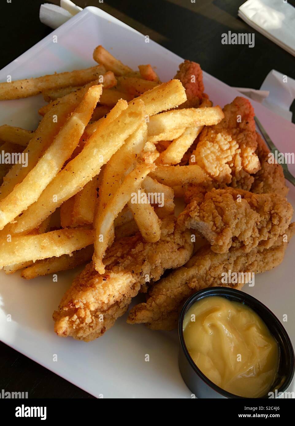 Dinner chicken tenders and fries Stock Photo Alamy