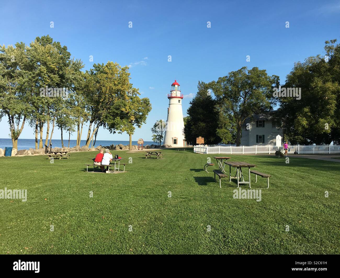 A senior couple enjoys the view of the Marblehead Lighthouse on Lake ...