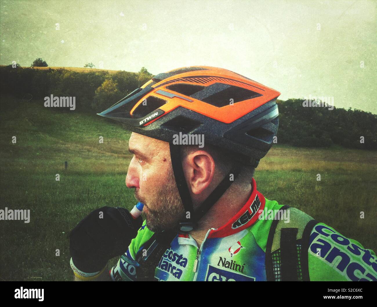 Mountain biker drinking from a hydration pack - Smartphone Captured Stock Image