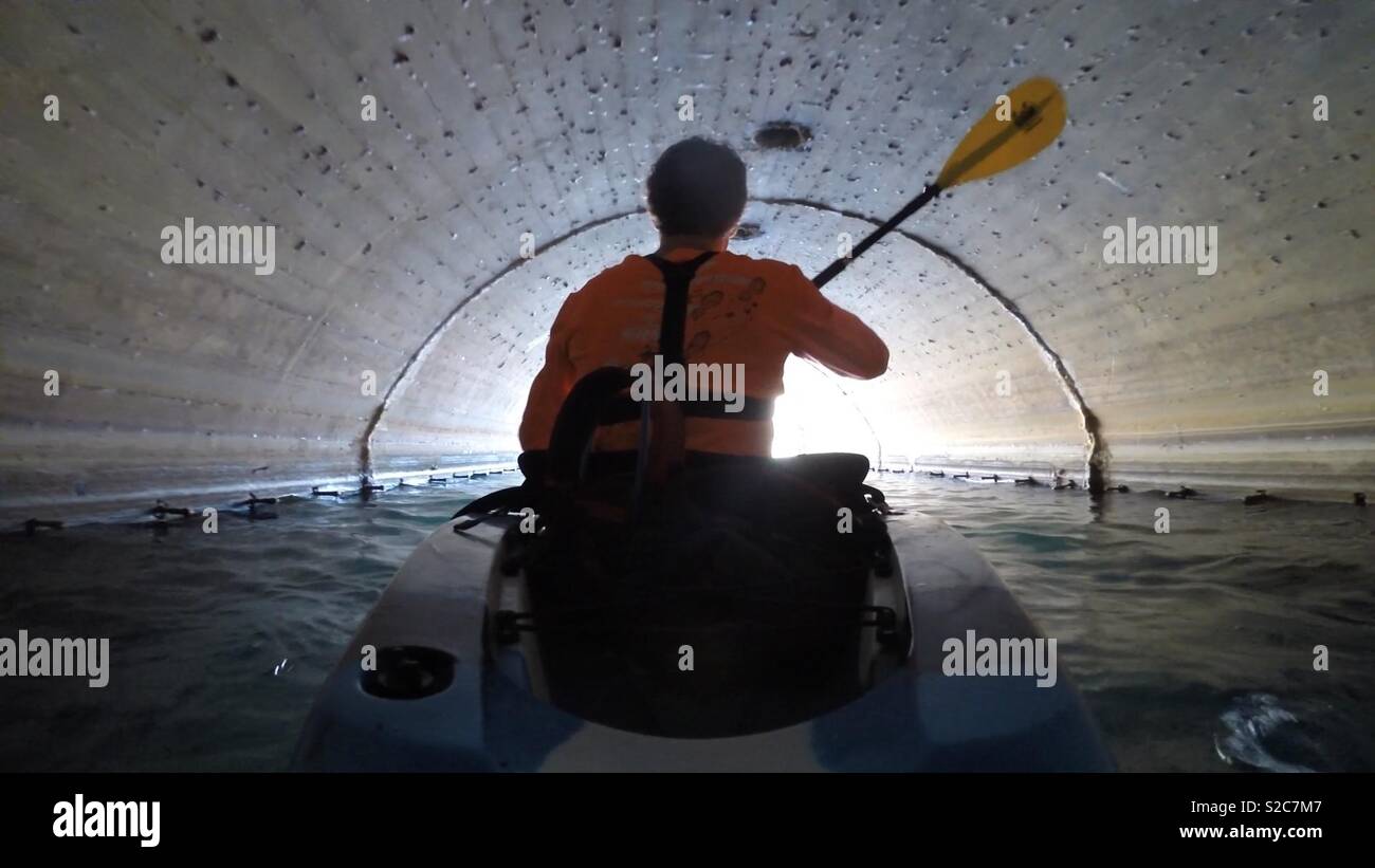 Kayaking through a tunnel Stock Photo