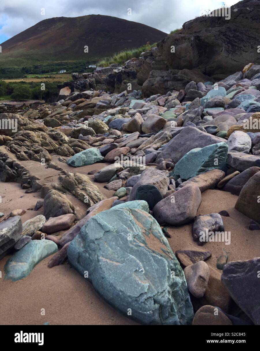 Colored Rocks Tourist Colorful rocks at the beach Stock Photo - Alamy