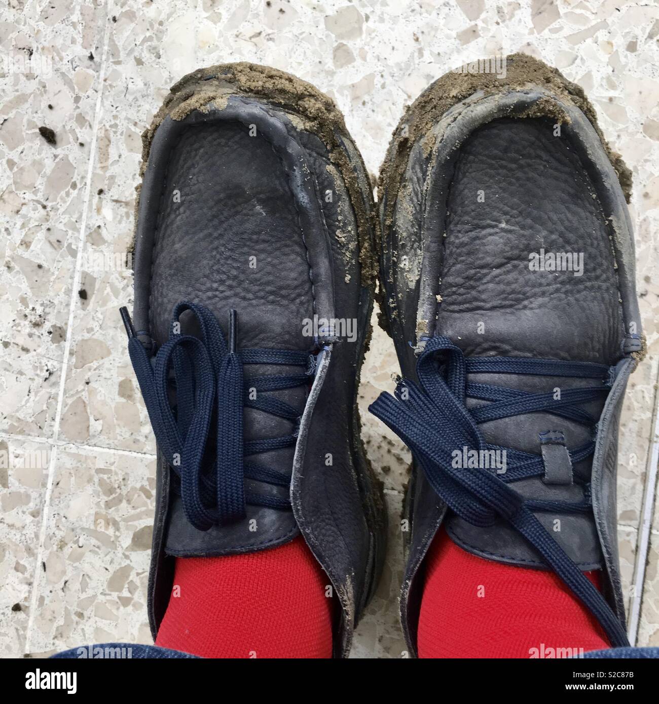 Muddy women’s shoes after Mudlarking on River Thames London closeup Stock Photo