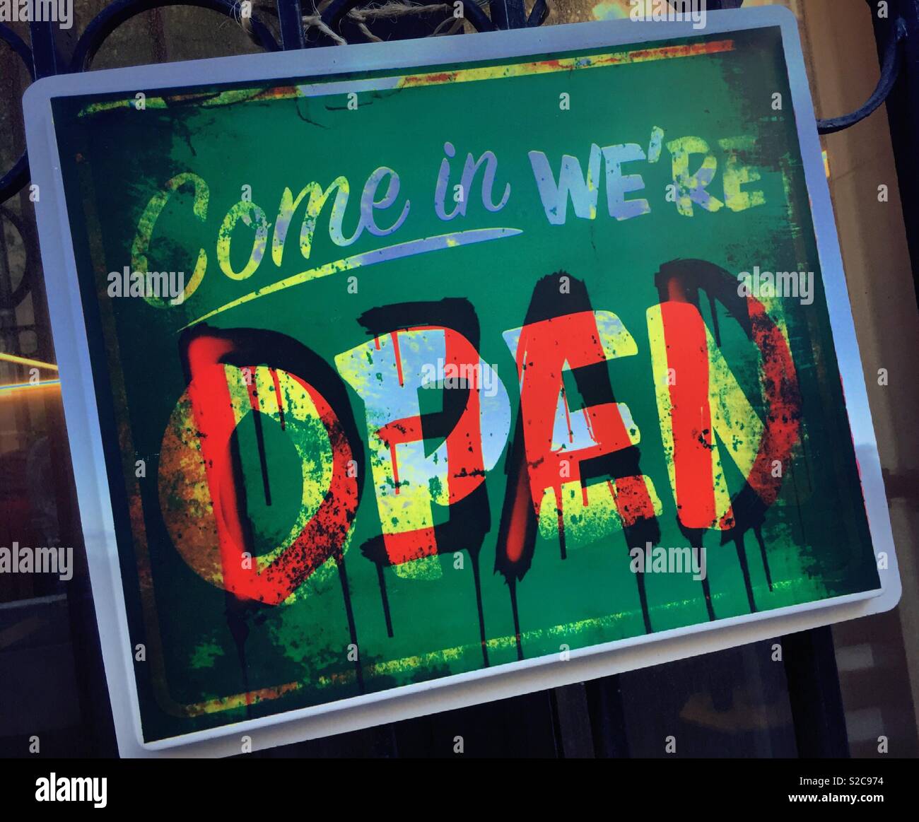 Halloween deemed sign at a business come in we’re open crossed out to