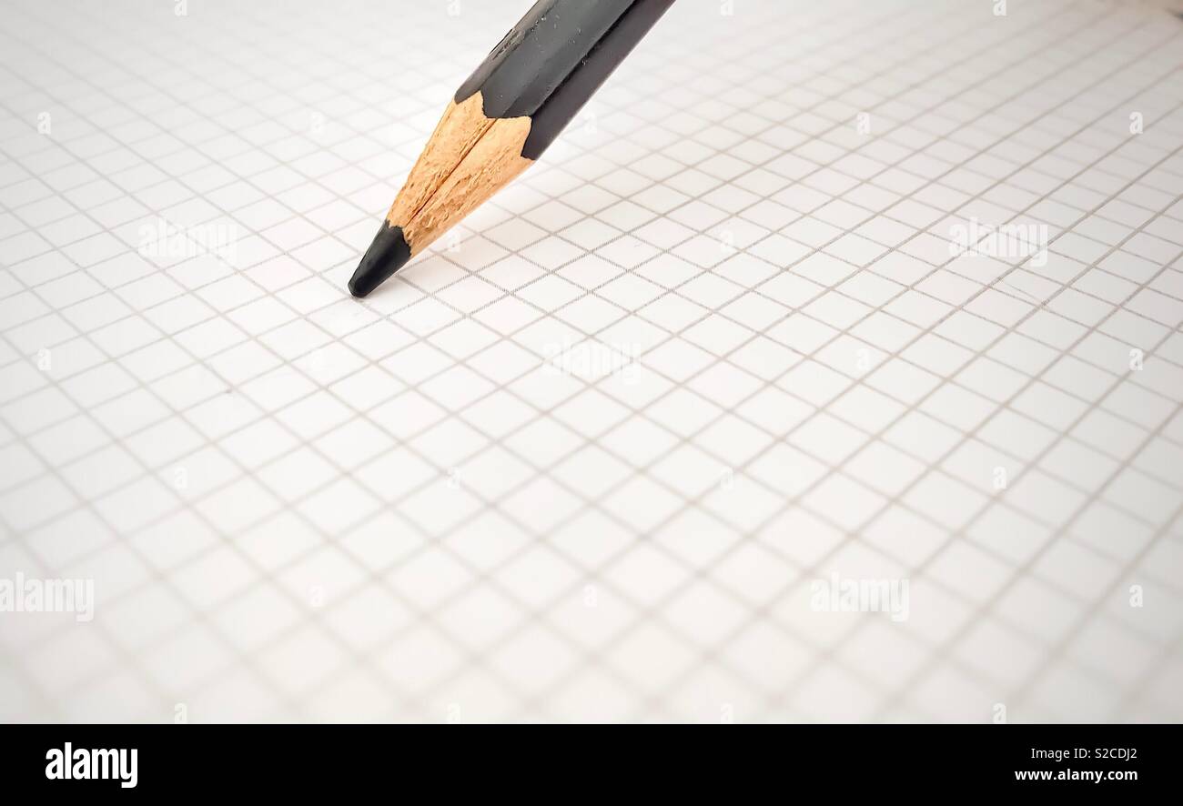 Black pencil on a blank squared sheet - Smartphone Captured Stock Image