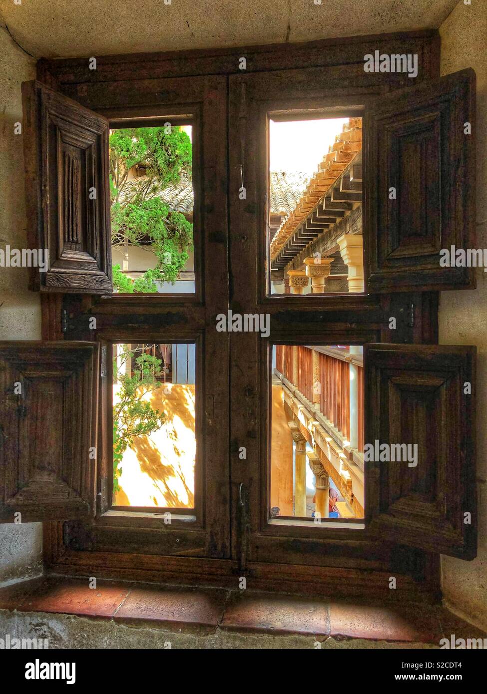 Looking through a window into a courtyard. - Smartphone Captured Stock Image
