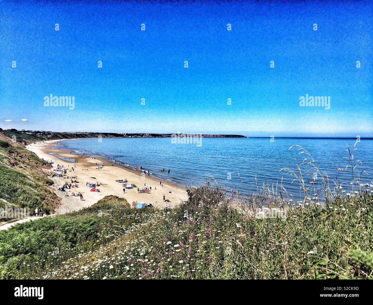 View of Hunmanby Beach with Filey and Filey Brig in the distance on a