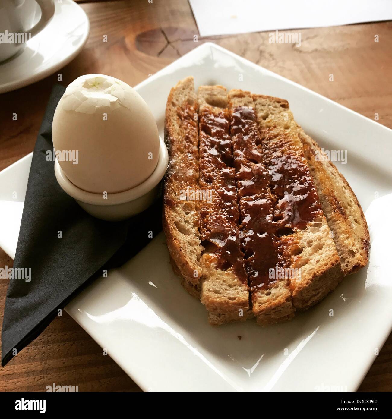Duck egg and toast with marmite Stock Photo