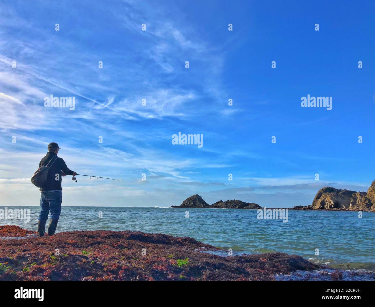 Angler bass fishing on the Gower peninsular, Wales, October. - Smartphone Captured Stock Image