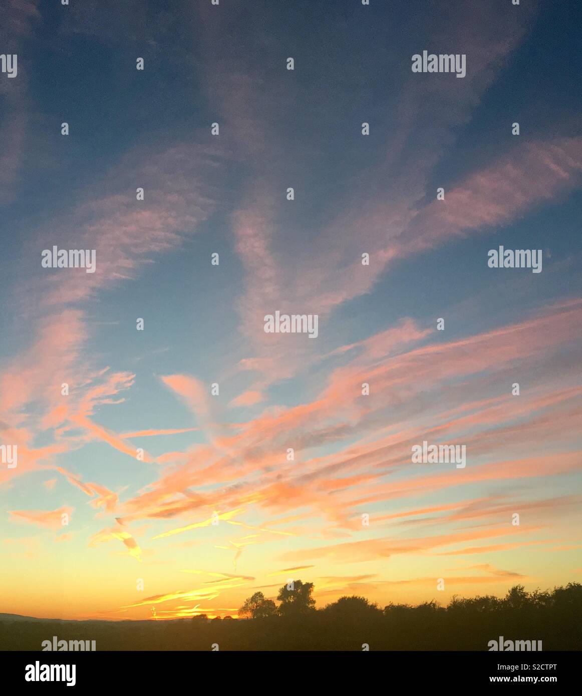 Orange and blue sky streaks Stock Photo - Alamy