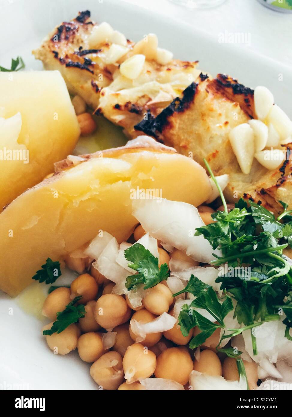 Traditional Portuguese cod with chickpeas Stock Photo Alamy