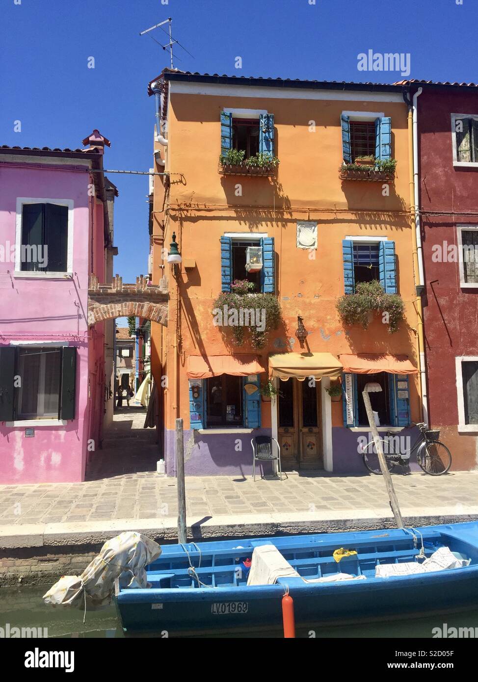 Colourful houses on the canal in Burano, Venice Stock Photo - Alamy
