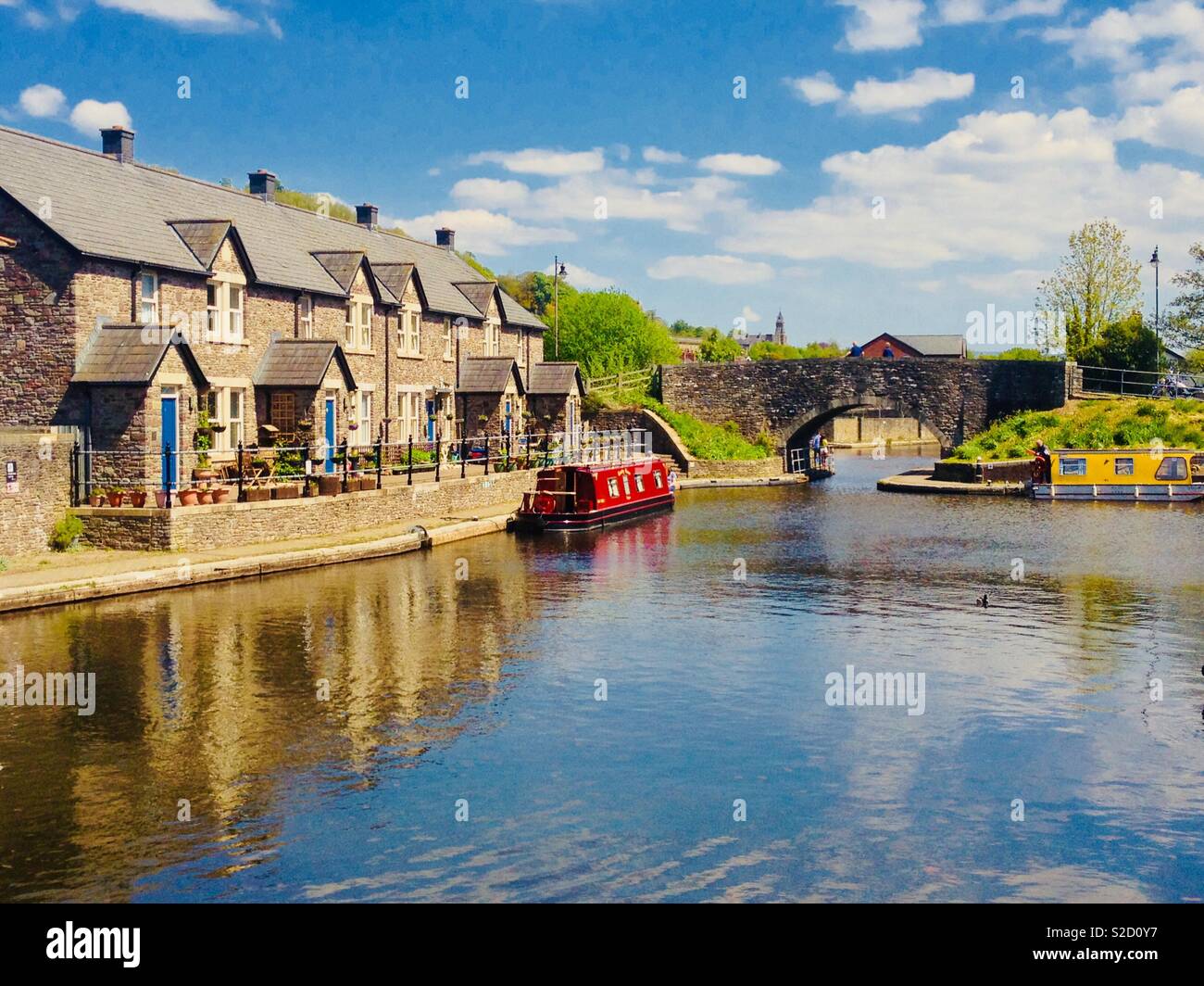 River boat by cottages Stock Photo