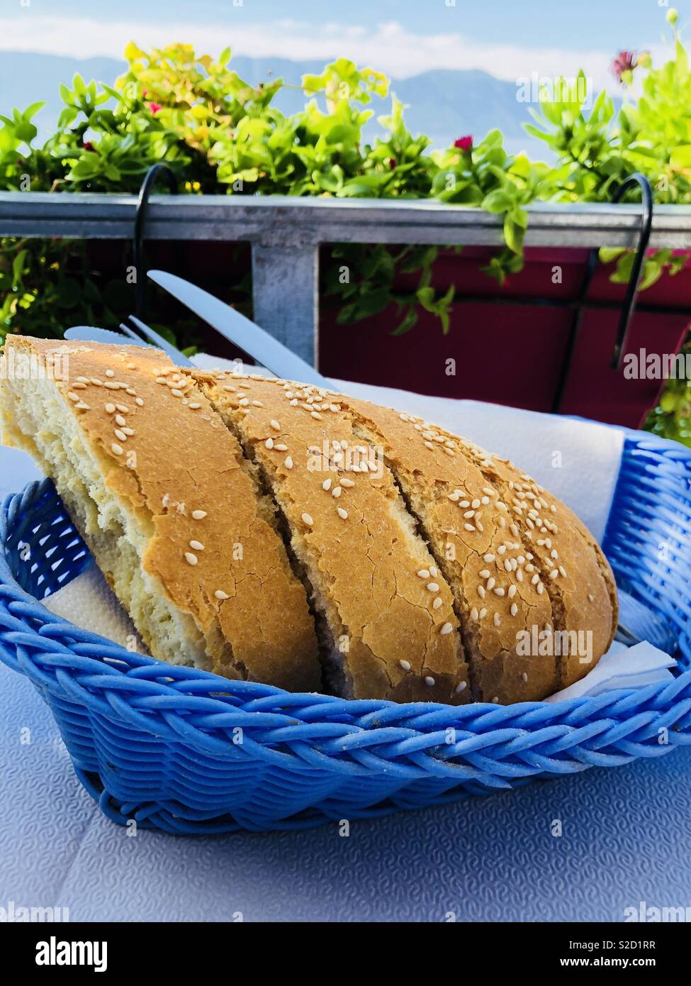 Brea in a blue basket by the sea on Evia in Greece Stock Photo Alamy