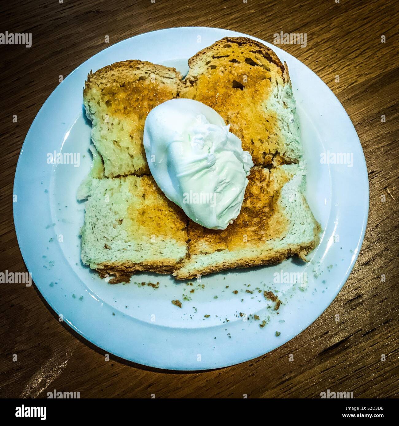 Poached egg on toast Stock Photo