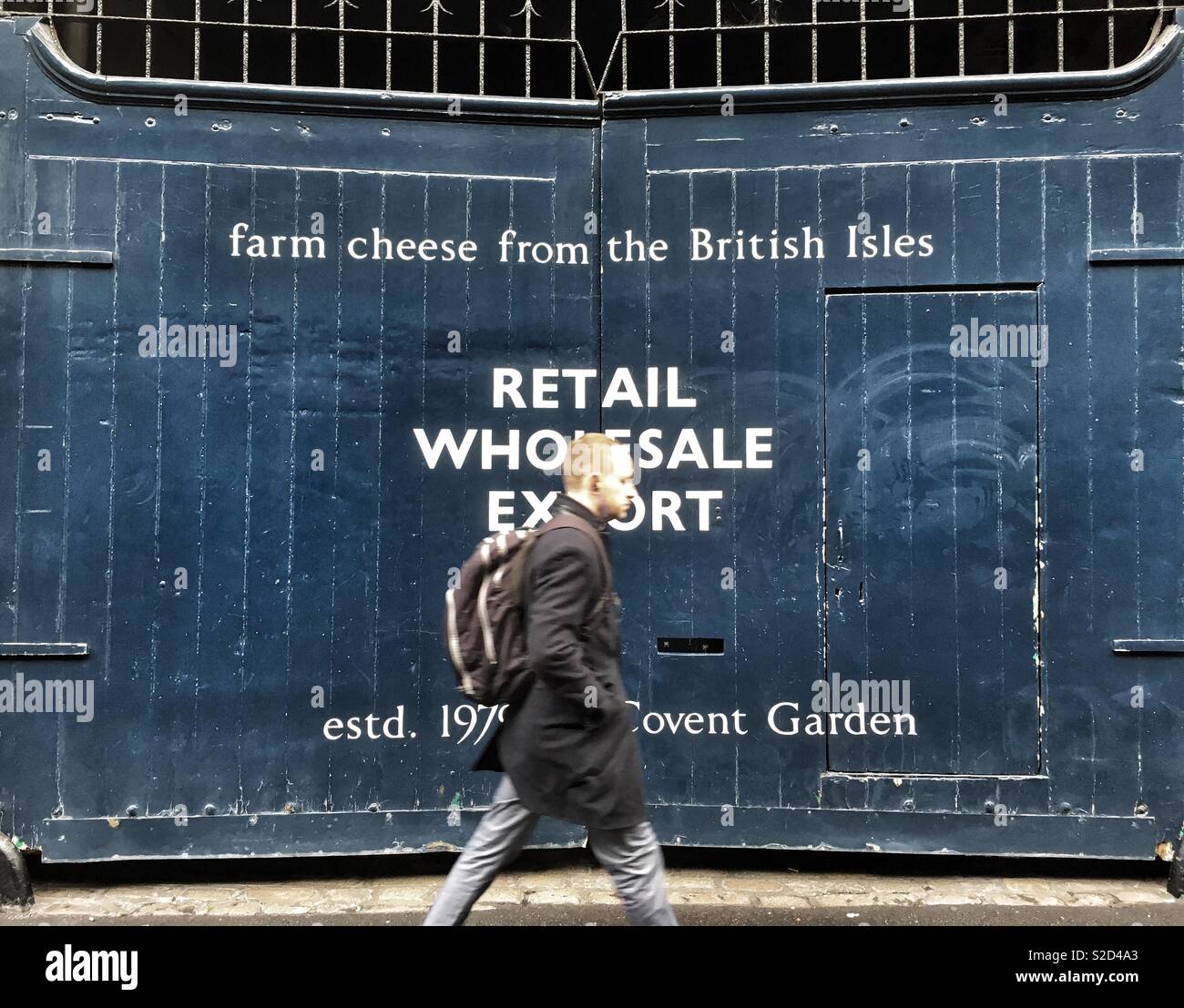 A man walks past Neal’s Yard Dairy on Park Street, London in England Stock Photo