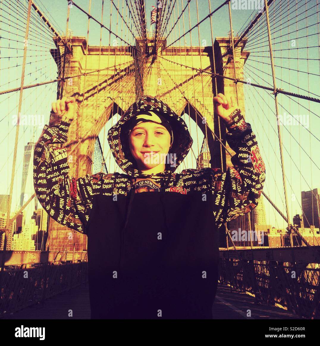 Nine year old boy on the Brooklyn Bridge, New York City, United States of America. Stock Photo