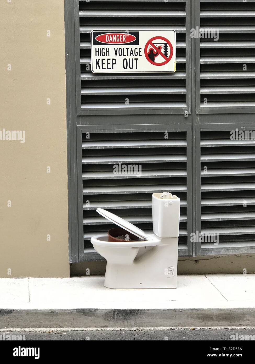 A discarded toilet left in the street in Ultimo, Sydney, NSW, Australia - Smartphone Captured Stock Image