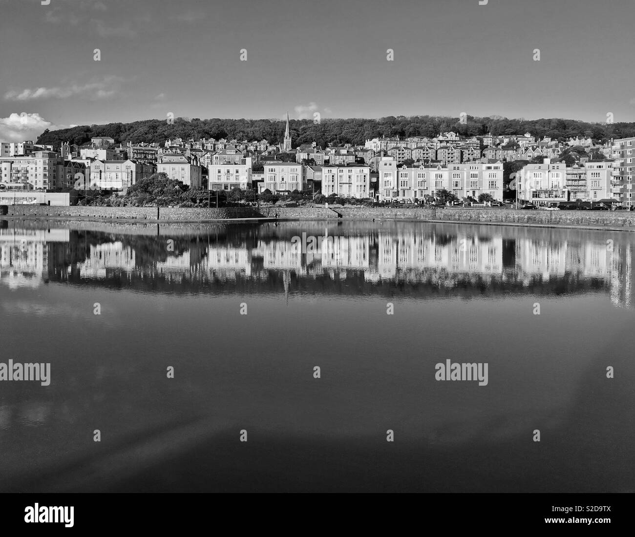 Buildings on the hillside reflected in the Marine Lake in Weston-super-Mare, UK Stock Photo
