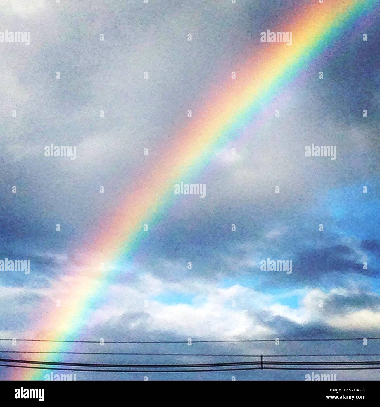 Rainbow in sky, optimism, happiness. Stock Photo