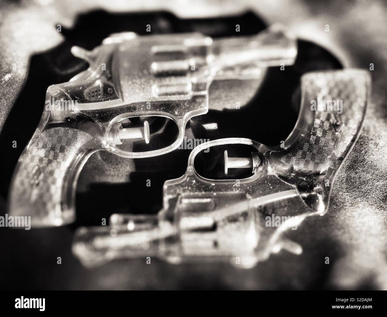 Close up of two isolated toy,water guns in monochrome Stock Photo