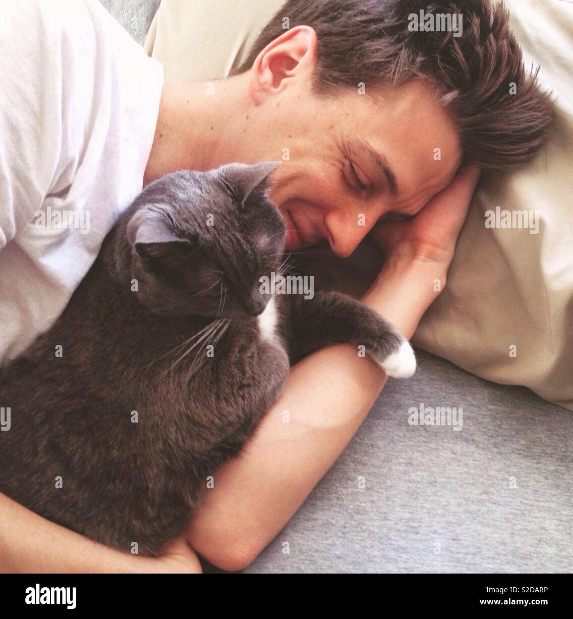 Man and cat, man with cat, cute cat - Smartphone Captured Stock Image