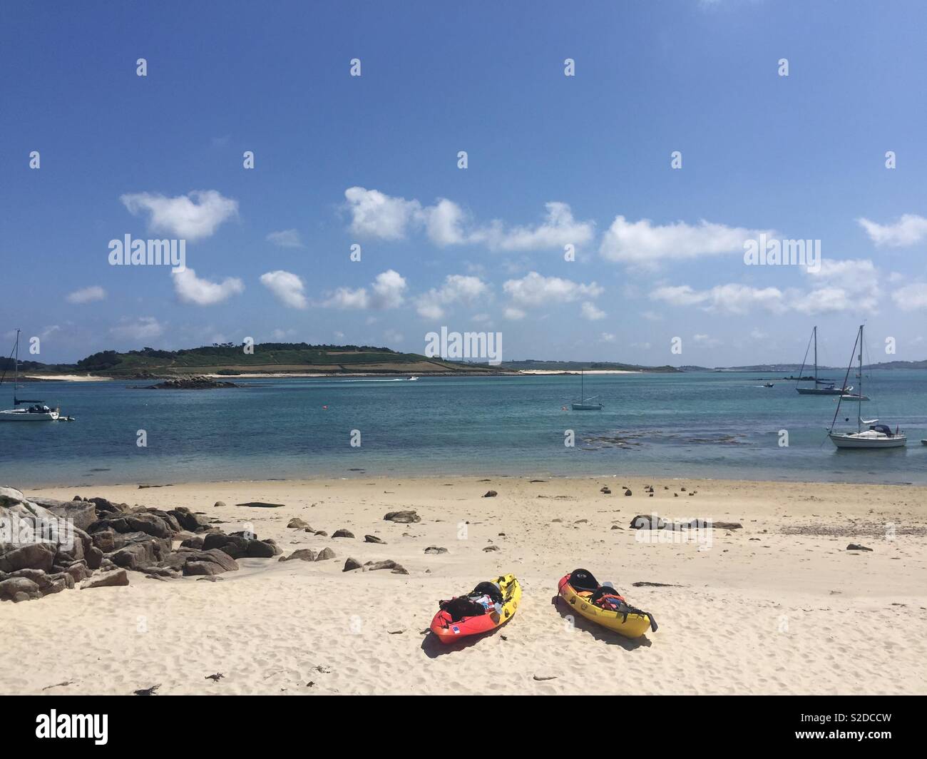 Adventure holiday kayaks on a sandy beach - Isles of Scilly, UK Stock Photo