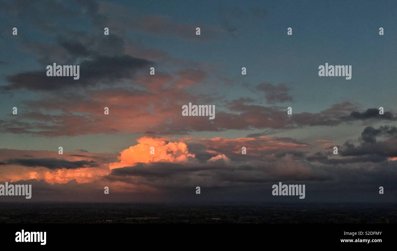 Sunset on clouds Stock Photo