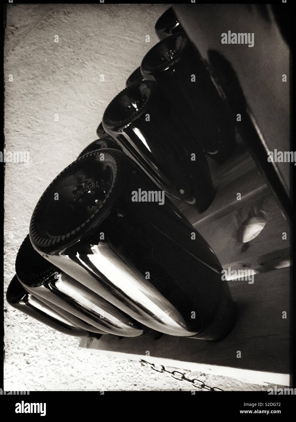 Removing yeast deposits from traditional method sparkling wine by using a riddling pupitre, Catalonia, Spain. - Smartphone Captured Stock Image