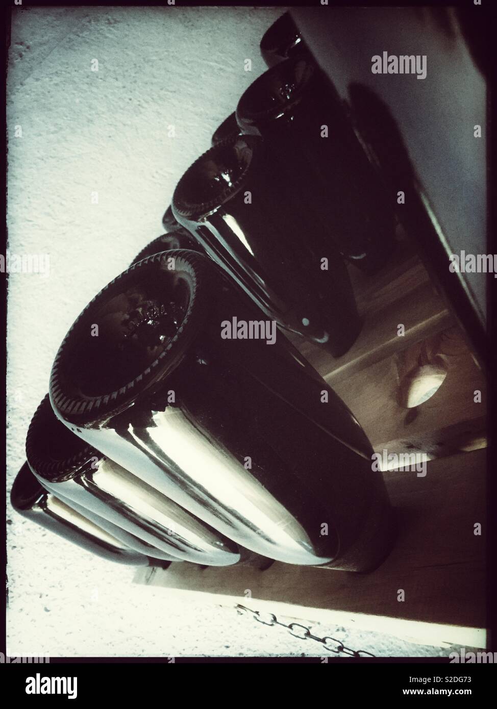 Removing yeast deposits from traditional method sparkling wine by using a riddling pupitre, Catalonia, Spain. - Smartphone Captured Stock Image