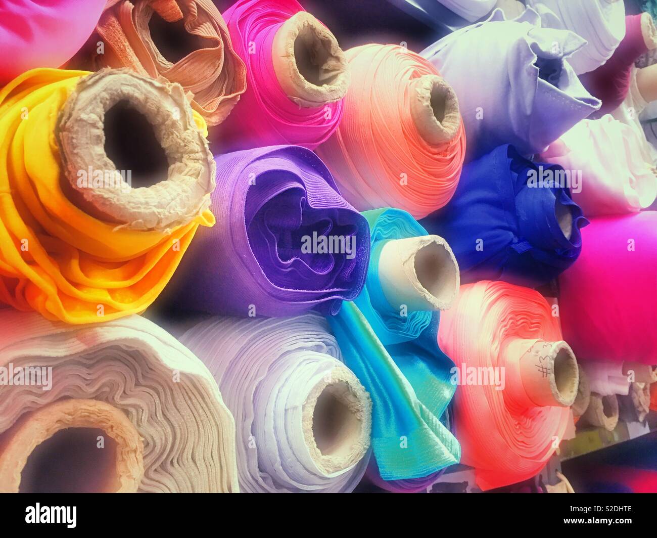Colorful fabric on display in a garment district store, New York City, USA - Smartphone Captured Stock Image