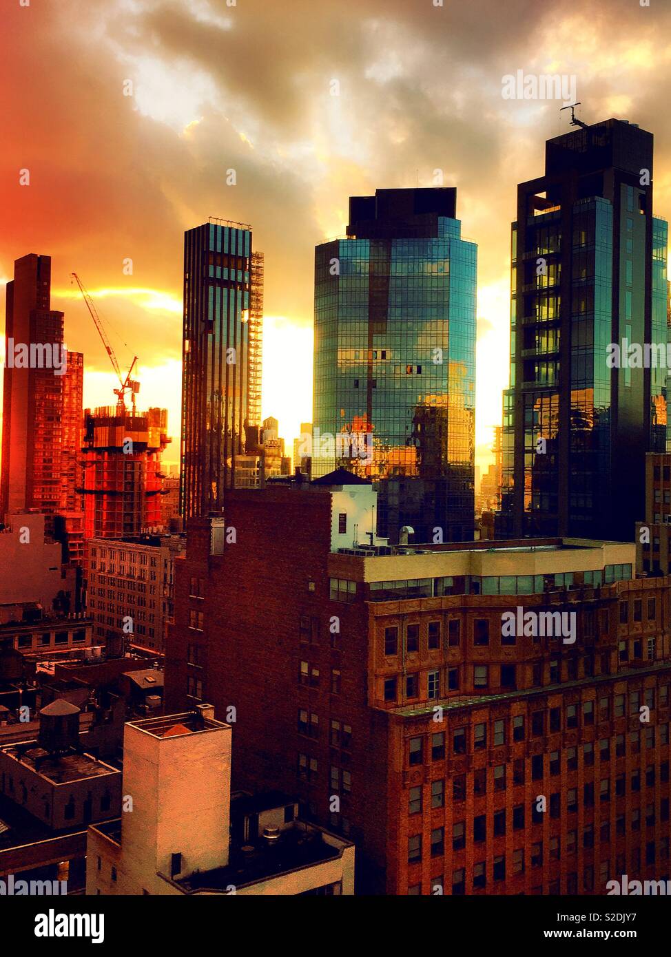 Skyscrapers and high-rise construction site at dusk in midtown Manhattan, NYC, USAA - Smartphone Captured Stock Image