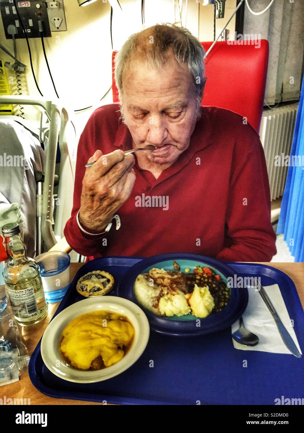 Patient in an NHS hospital eating dinner - Smartphone Captured Stock Image