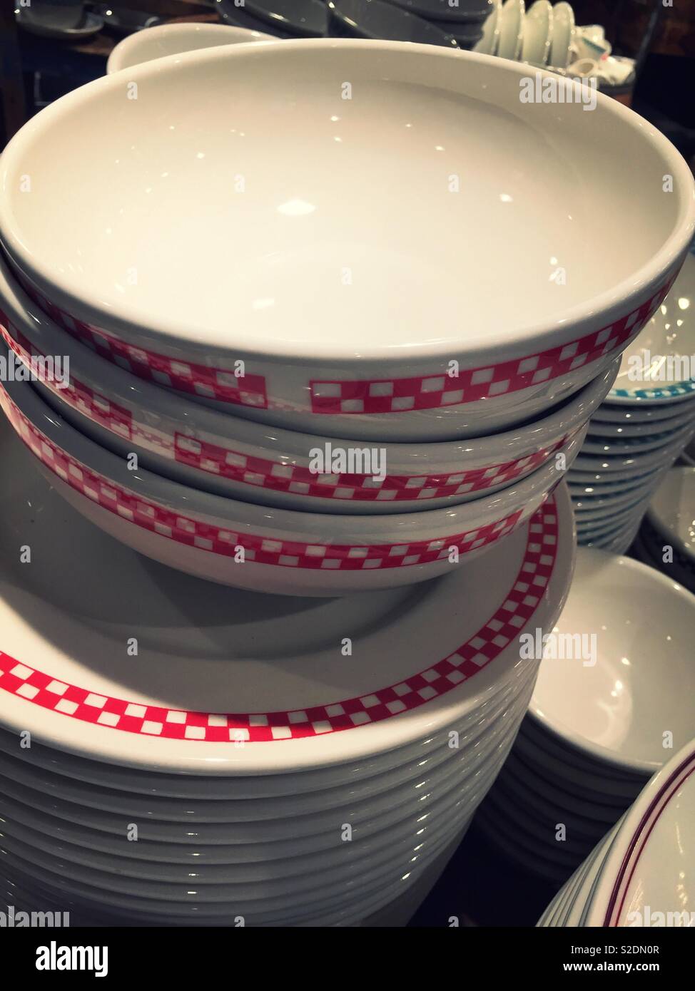 Display of bowls and plates for sale in a  houseware store, United States - Smartphone Captured Stock Image