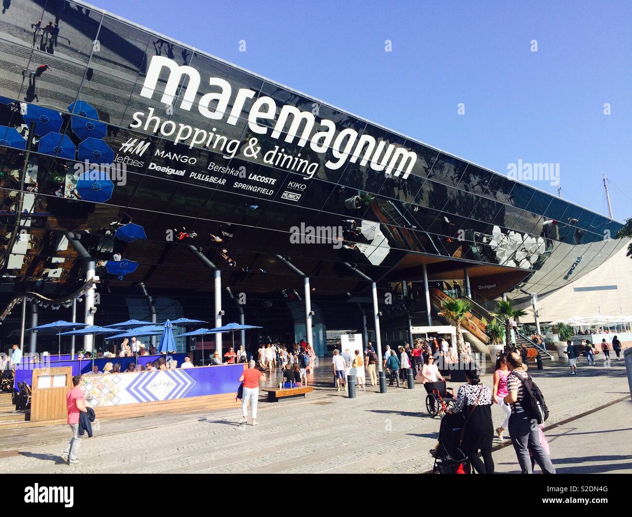 Maremagnum shopping centre or mall close to Barcelona Port Vell on a busy afternoon in Autumn Stock Photo