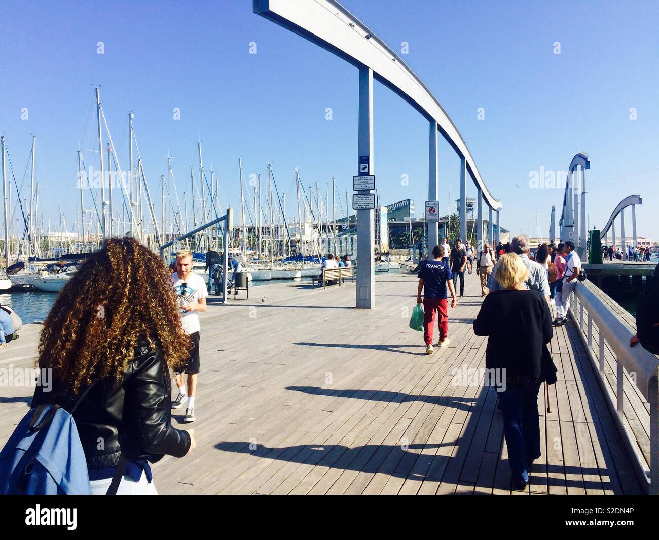 Walkway or bridge to the Maremagnum shopping mall in Barcelona Spain on a  sunny Autumn day Stock Photo - Alamy