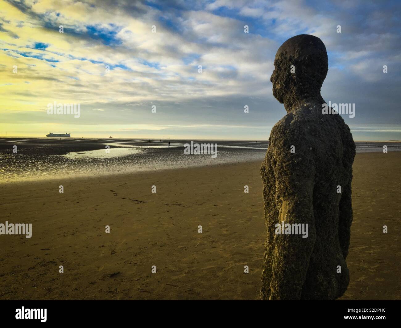 Iron statue, part of Antony Gormley’s installation, “Another Place” on